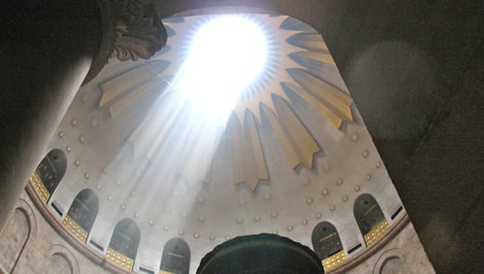 The sunlit dome over where Christ rose from the dead in the Church of the Holy Sepulchre