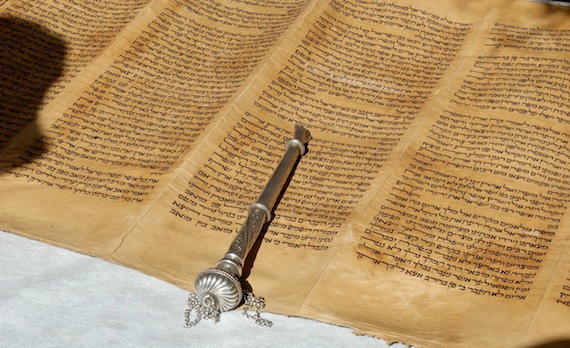 A Torah Scroll with a pointer.